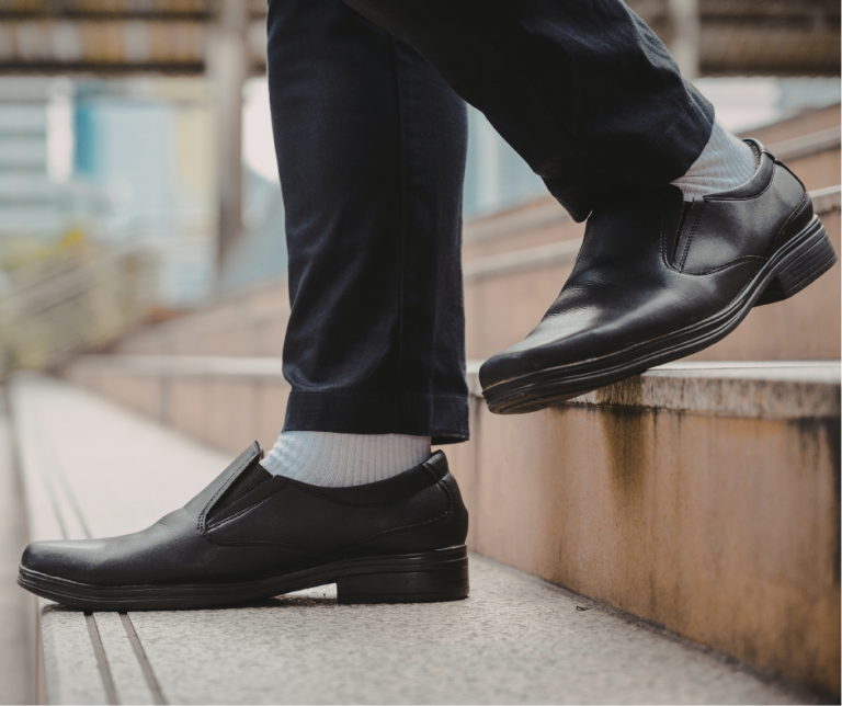 Home 28 businessman's feet walking down stairs