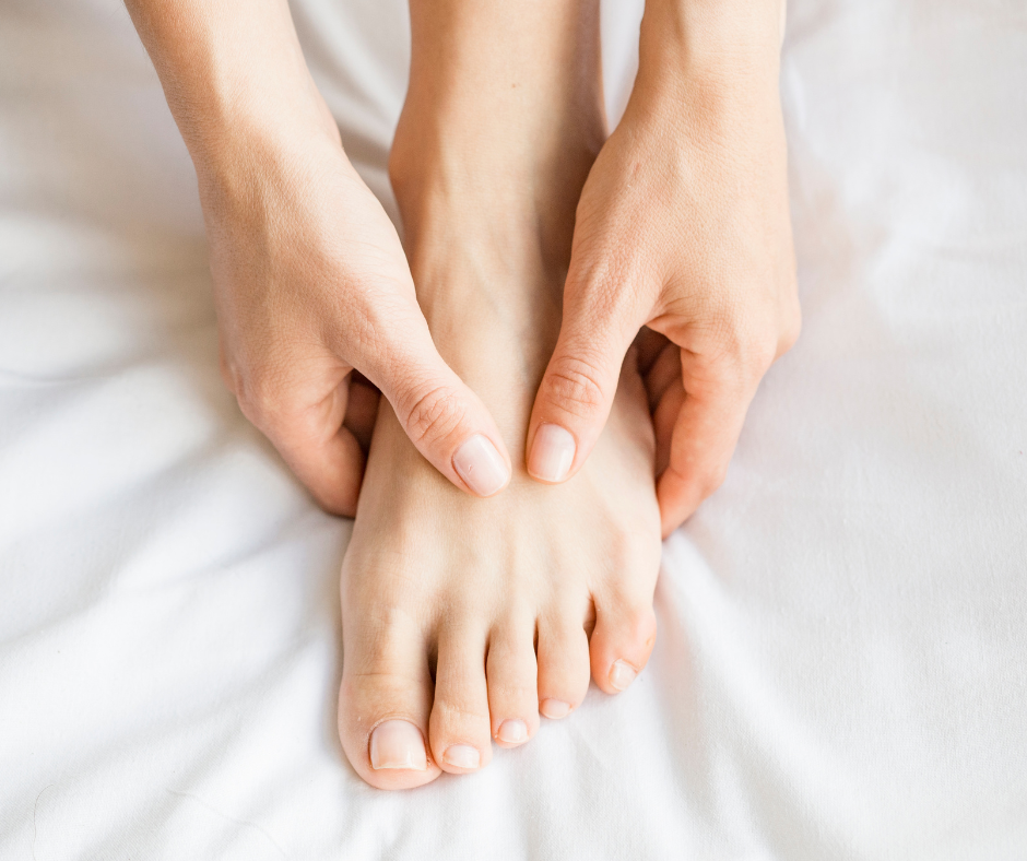hand rubbing top of foot